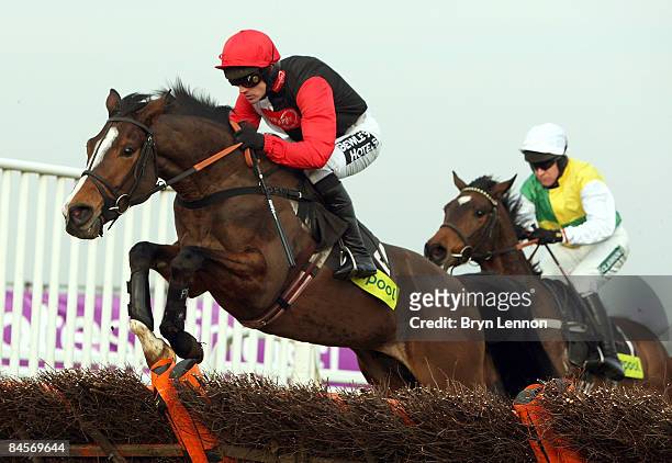 Ruby Walsh riding Celestial Halo jumps the final hurdle to before winning the Contenders Hurdle race at Sandown Park Race Course on January 31, 2009...