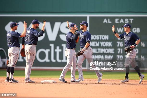 The Tampa Bay Rays high five each other after a victory over the Boston Red Sox at Fenway Park on September 10, 2017 in Boston, Massachusetts.