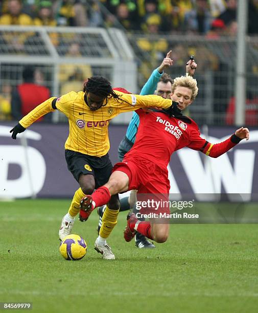 Tinga of Dortmund and Simon Rolfes of Leverkusen battle for the ball during the Bundesliga match between Borussia Dortmund and Bayer Leverkusen at...