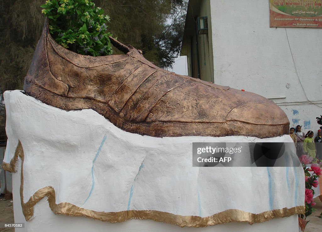(FILES) -- A bronze shoe sculpture honou