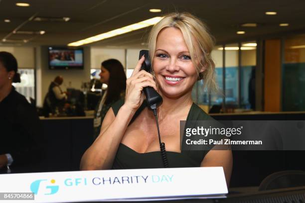 Pamela Anderson participates in the Annual Charity Day hosted by Cantor Fitzgerald, BGC and GFI at GFI Securities on September 11, 2017 in New York...
