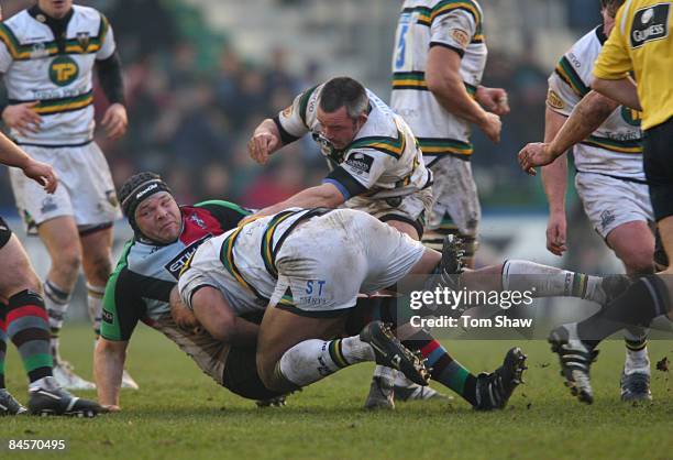 Mike Ross of Harlequins is tackled during the Guinness Premiership match between Harlequins and Northampton Saints at the Stoop on January 31, 2009...