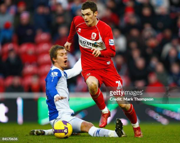 Adam Johnson of Middlesbrough tangles with Morten Gamst Pedersen of Blackburn during the Barclays Premier League match between Middlesbrough and...