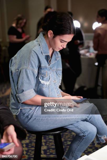 Model prepares backstage for Dennis Basso fashion show during New York Fashion Week: The Shows at The Plaza Hotel on September 11, 2017 in New York...