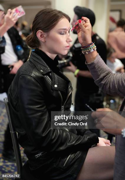 Model prepares backstage for Dennis Basso fashion show during New York Fashion Week: The Shows at The Plaza Hotel on September 11, 2017 in New York...