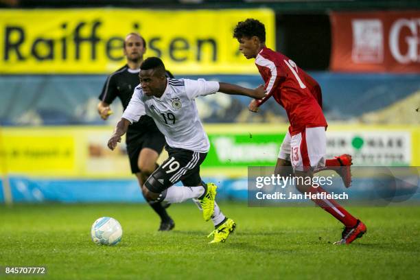 Youssoufa Moukoko of Germany and Simon Nosa Salami Nelson of Austria fight for the ball during the friendly match between U16 Austria and U16 Germany...