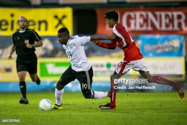 Youssoufa Moukoko of Germany and Simon Nosa Salami Nelson of Austria fight for the ball during the friendly match between U16 Austria and U16 Germany...