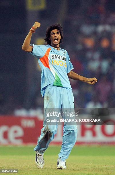 Indian bowler Ishant Sharma celebrates taking the wicket of Sri Lankan cricketer Farveez Maharoof during the second One Day International match...