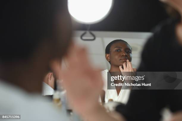 Model prepares backstage for Hakan Akkaya fashion show during New York Fashion Week: The Shows at Gallery 2, Skylight Clarkson Sq on September 11,...