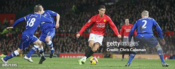 Cristiano Ronaldo of Manchester United in aciton against Phil Neville and Tony Hibbert of Everton during the Barclays Premier League match between...