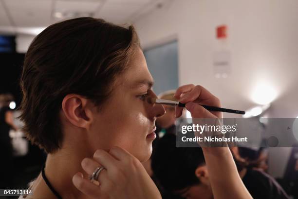 Model prepares backstage for Hakan Akkaya fashion show during New York Fashion Week: The Shows at Gallery 2, Skylight Clarkson Sq on September 11,...