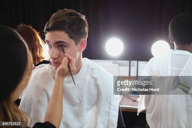 Model prepares backstage for Hakan Akkaya fashion show during New York Fashion Week: The Shows at Gallery 2, Skylight Clarkson Sq on September 11,...
