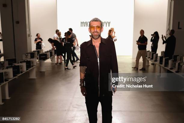 Designer Hakan Akkaya prepares backstage for Hakan Akkaya fashion show during New York Fashion Week: The Shows at Gallery 2, Skylight Clarkson Sq on...