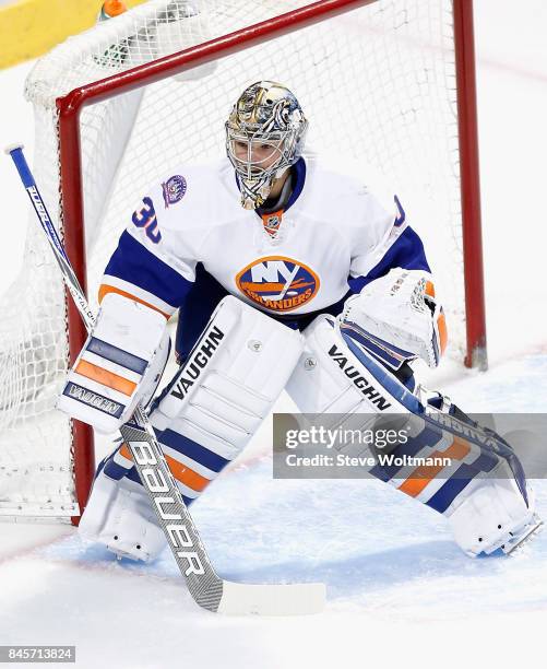 Goaltender Michal Neuvirth of the New York Islanders plays in the game against the Chicago Blackhawks at the United Center on March 17, 2015 in...