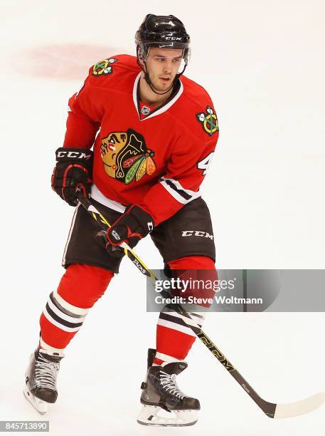 Niklas Hjalmarsson of the Chicago Blackhawks plays in the game against the New York Islanders at the United Center on March 17, 2015 in Chicago,...