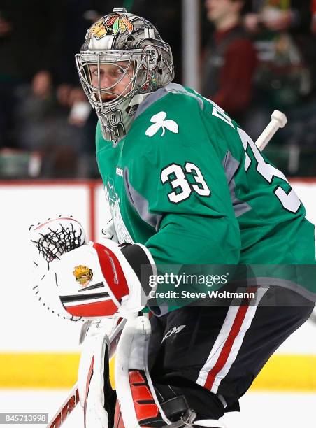 Goaltender Scott Darling of the Chicago Blackhawks warms up before the game against the New York Islanders at the United Center on March 17, 2015 in...