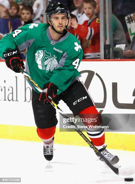 Niklas Hjalmarsson of the Chicago Blackhawks warms up before the game against the New York Islanders at the United Center on March 17, 2015 in...