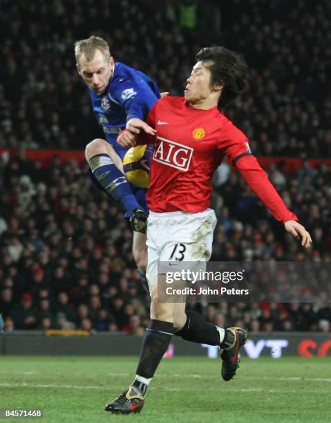 Ji-Sung Park of Manchester United clashes with Tony Hibbert of Everton during the Barclays Premier League match between Manchester United and Everton...