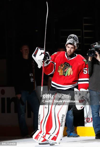 Goaltender Corey Crawford of the Chicago Blackhawks acknowledges the crowd after the game against the New York Islanders at the United Center on...