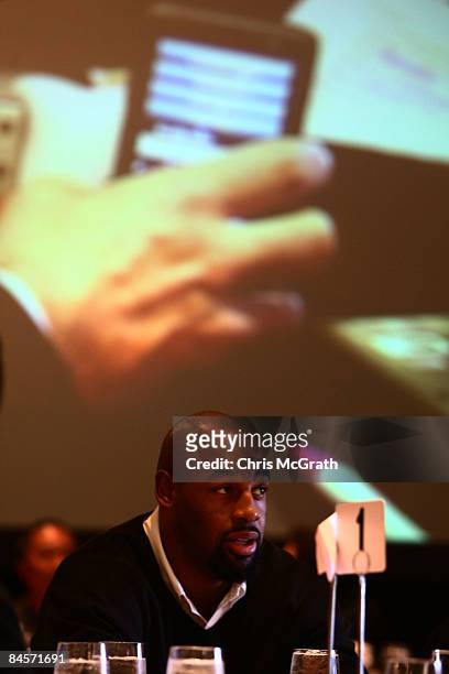 Philadelphia Eagles quarterback Donovan McNabb watches a demonstration of the ID Coach on a big screen at the launch of the Isaac Daniel, ID Coach at...