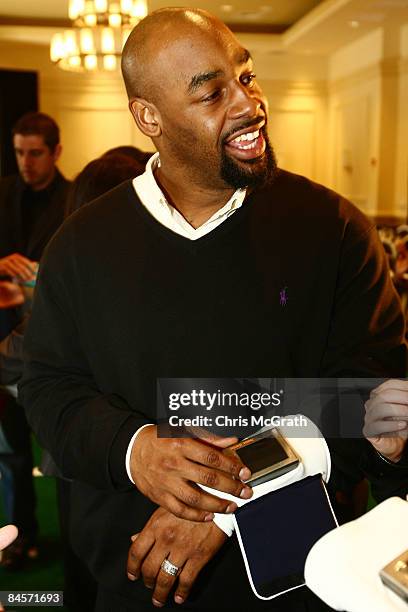 Philadelphia Eagles quarterback Donovan McNabb plays with the ID Coach Wristband at the launch of the Isaac Daniel, ID Coach at the Sheraton...