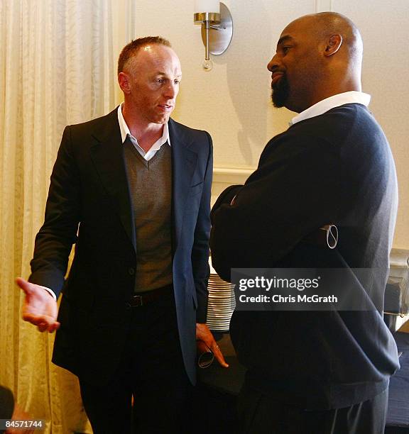 Jeff Garcia talks with Donovan McNabb at the launch of the Isaac Daniel, ID Coach at the Sheraton Riverwalk on January 31, 2009 in Tampa, Florida....