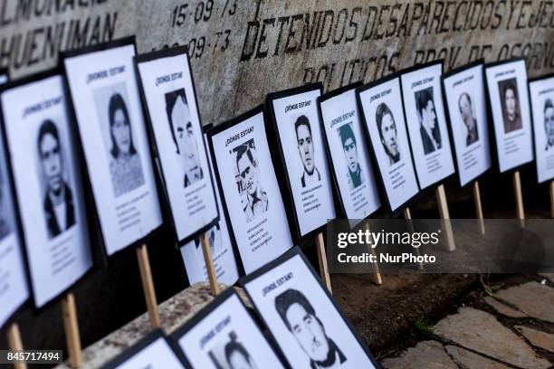 Osorno, Chile. 11 September 2017. Photographs with the faces of disappeared detainees of the military dictatorship. Relatives of the Disappeared,...