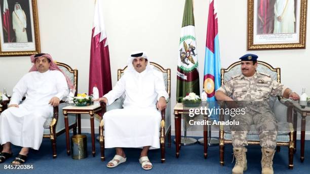 Qatari Sheikh Tamim bin Hamad Al Thani and Minister of State for Defense of Qatar, Khalid bin Mohammad Al Attiyah with Qatari Chief of the Army...