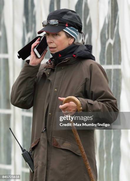 Princess Anne, Princess Royal uses her mobile phone as she attends day 3 of the Whatley Manor Horse Trials at Gatcombe Park on September 10, 2017 in...