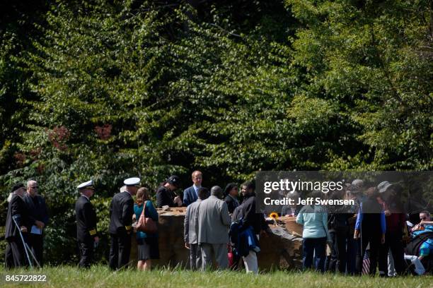 Family members gather at the crash site of the plane at the Flight 93 National Memorial on the 16th Anniversary ceremony of the September 11th...