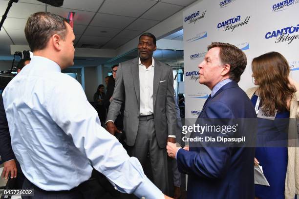 Basketball player Larry Johnson and Sportcaster Bob Costas participate in Annual Charity Day hosted by Cantor Fitzgerald, BGC and GFI at Cantor...