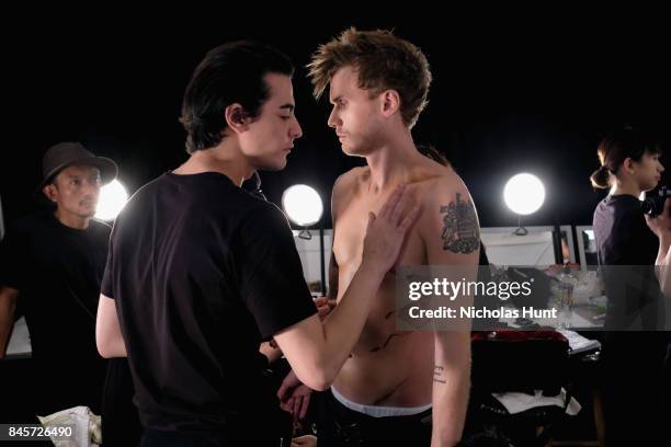 Model Barron Hilton II prepares backstage for Hakan Akkaya fashion show during New York Fashion Week: The Shows at Gallery 2, Skylight Clarkson Sq on...