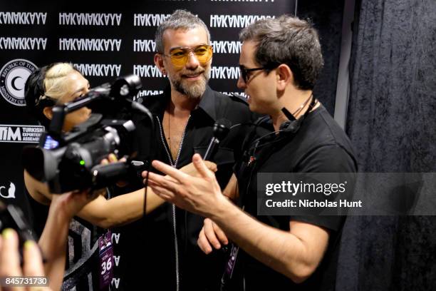 Designer Hakan Akkaya gives an interview backstage for Hakan Akkaya fashion show during New York Fashion Week: The Shows at Gallery 2, Skylight...