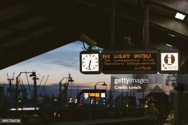 clock on baumwall metro station in hamburg - metro hamburg stock pictures, royalty-free photos & images