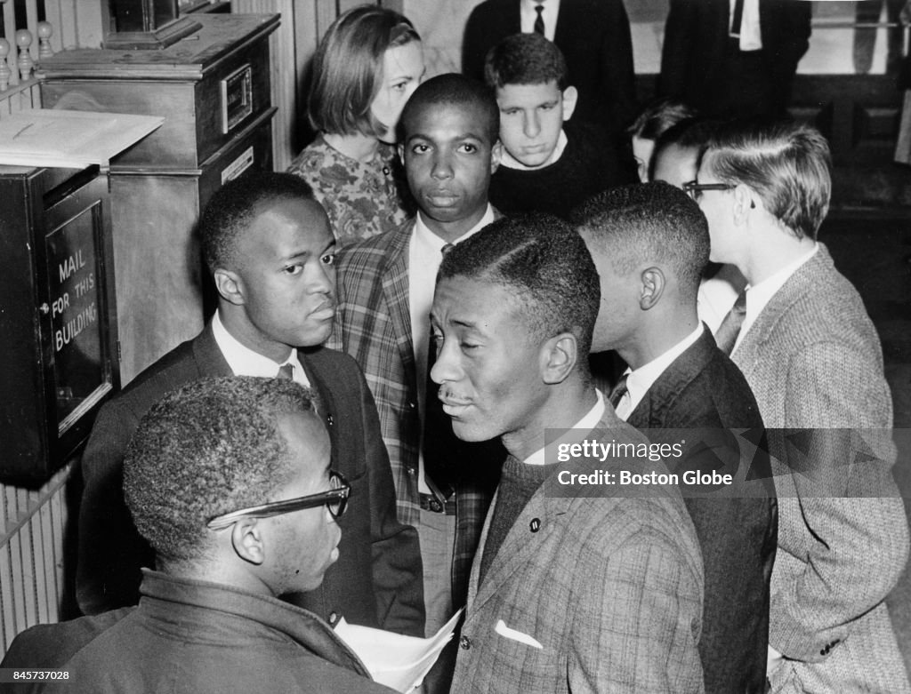 Members of the Boston branch of the NAACP wait for the elevator to