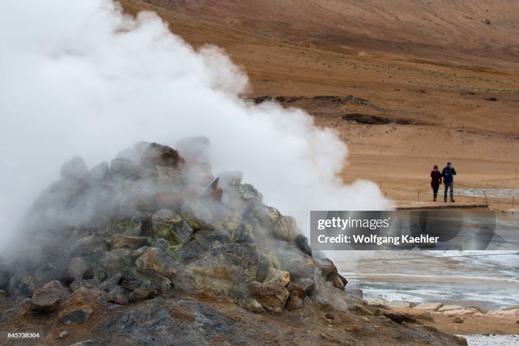Steaming borehole in the hot spring area named Hverir, east...