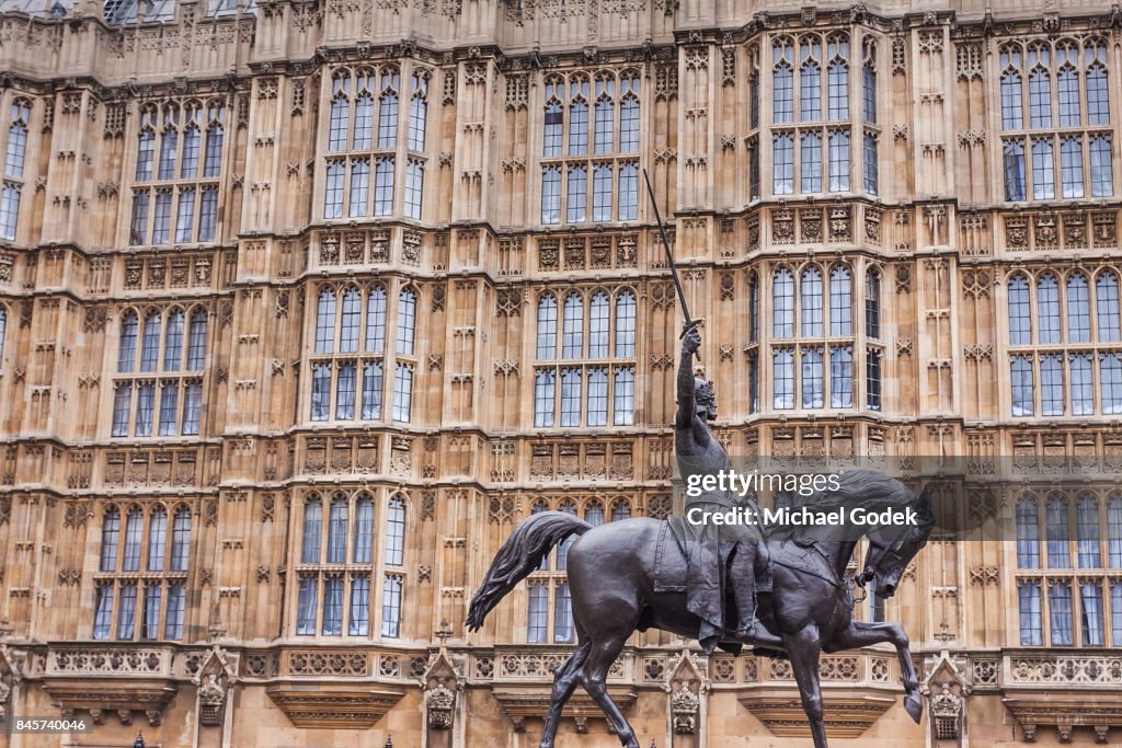 Statue in front of houses of Parliament in Westminster
