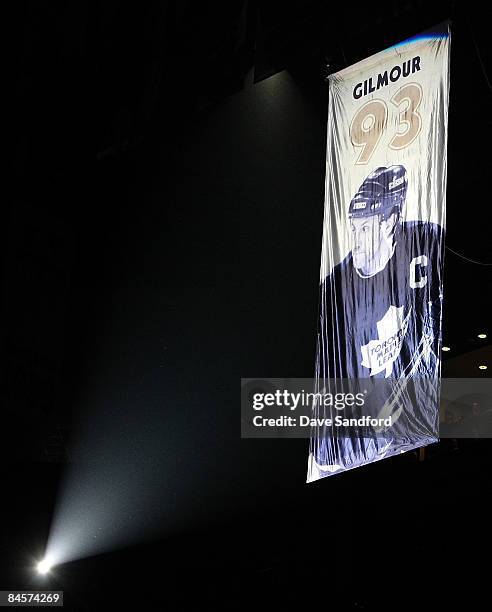 Former Toronto Maple Leaf Doug Gilmour's is raised to the rafters prior to the Toronto Maple Leafs taking on the Pittsburgh Penguins during their NHL...