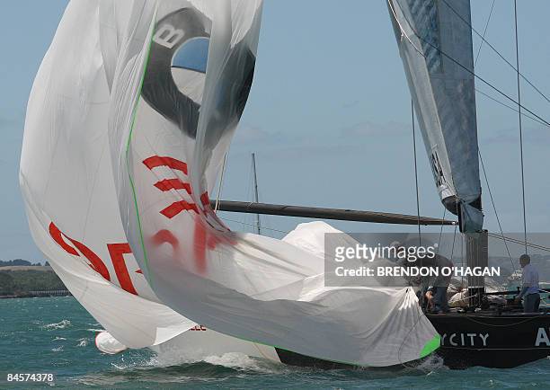 Oracle from the US brings in their spinaker during there race with Team China during round robin 3 of the series of the Louis Vuitton Pacific Cup...