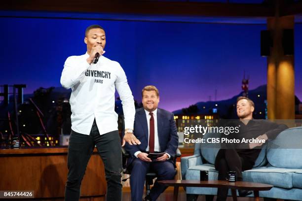 Damian Lillard performs an impromptu rap while Taron Egerton and James Corden watch during "The Late Late Show with James Corden," Friday, September...