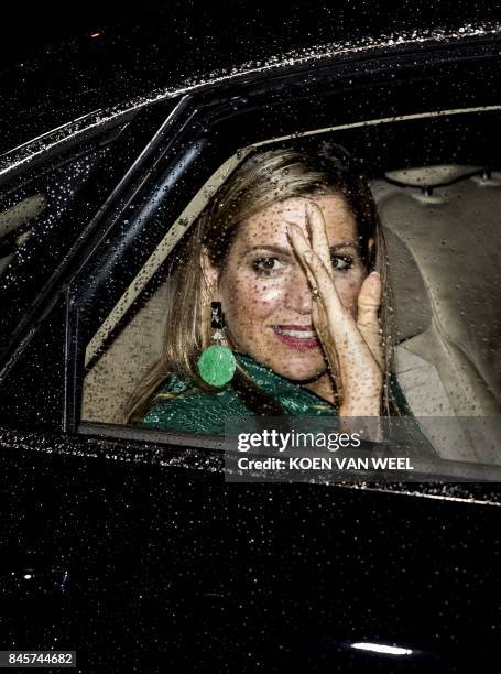 Queen Maxima of the Netherlands waves from a car as she attends the 8th edition of the LOEY Awards in Amsterdam on September 11, 2017. The LOEY is...