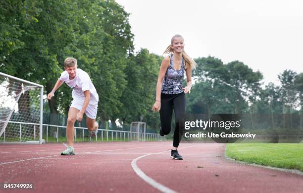 Duelmen, Germany Two youngsters train on a sports ground and have a race. Staged picture on August 10, 2017 in Duelmen, Germany.