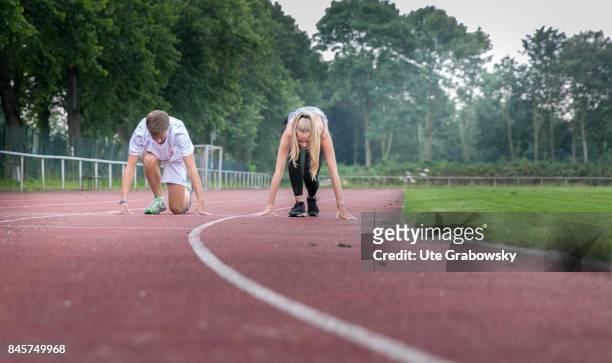 Duelmen, Germany Two youngsters train on a sports ground and start to sprint. Staged picture on August 10, 2017 in Duelmen, Germany.