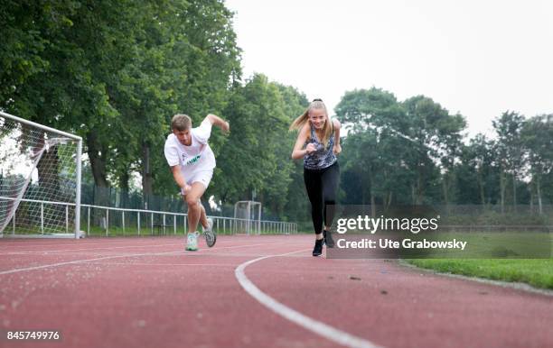 Duelmen, Germany Two youngsters train on a sports ground and start to sprint. Staged picture on August 10, 2017 in Duelmen, Germany.