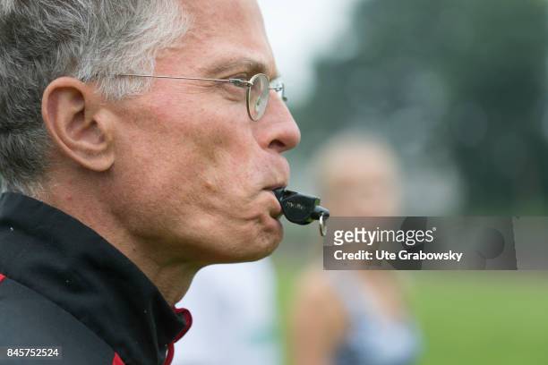 Duelmen, Germany Close-up of a coach with whistle on a sports field. Staged picture on August 10, 2017 in Duelmen, Germany.
