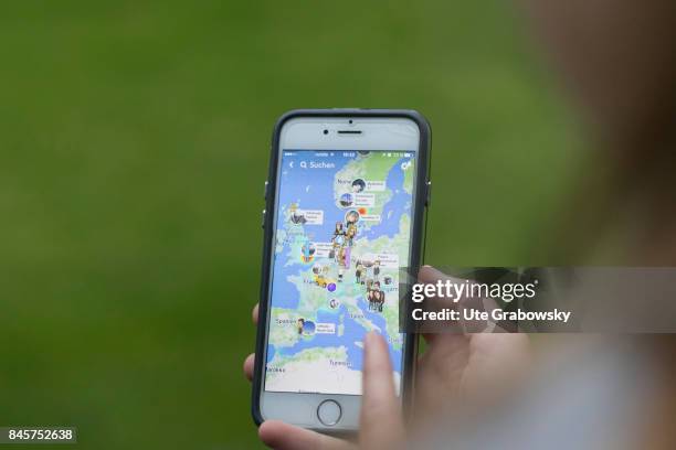 Duelmen, Germany Teenager looks at a map, on which friends are marked, on Snapchat, a social media app on a smartphone. Staged picture on August 10,...