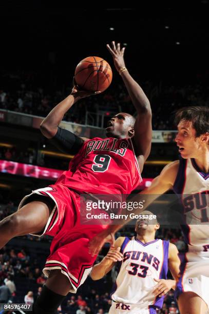 Luol Deng of the Chicago Bulls puts a shot up against the Phoenix Suns in an NBA game played on January 31 at U.S. Airway Center in Phoenix, Arizona....