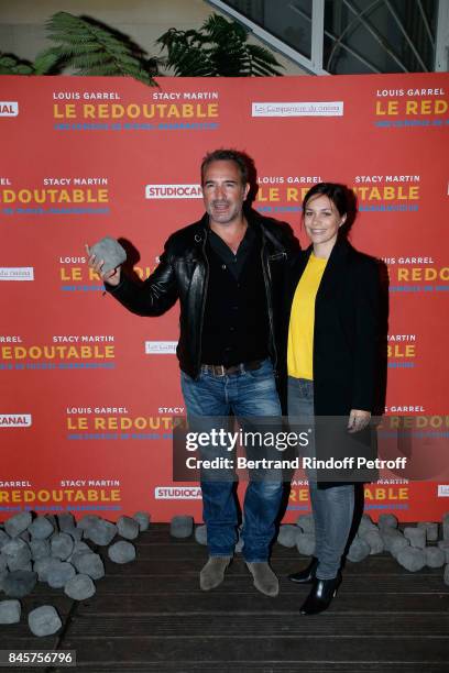 Actor Jean Dujardin and Nathalie Pechalat attend the "Le Redoutable" Paris Premiere at Cinema du Pantheon on September 11, 2017 in Paris, France.