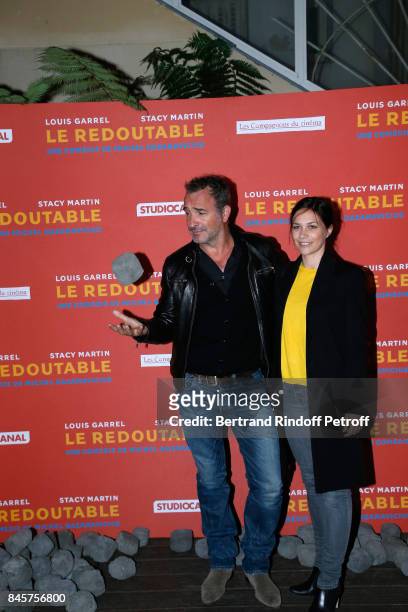Actor Jean Dujardin and Nathalie Pechalat attend the "Le Redoutable" Paris Premiere at Cinema du Pantheon on September 11, 2017 in Paris, France.