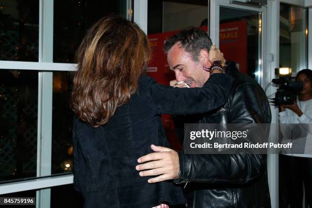 Actors Elsa Zylberstein and Jean Dujardin attend the "Le Redoutable" Paris Premiere at Cinema du Pantheon on September 11, 2017 in Paris, France.